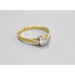 An 18ct and solitaire diamond ring,size Q, gross weight 2.5 grams, the stone weighing approximately