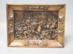 A 19th century Continental relief carved fruitwood plaque depicting a procession, 39 x 30cm