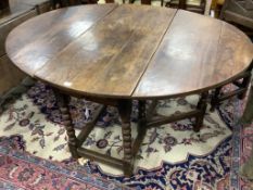 A six-seater oak gateleg dining table, late 17th century, 148cm (extended) depth 122cm, 74cm high.