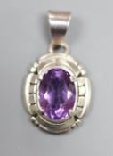 A continental sterling and amethyst set oval pendant, signed Carl Quintana,24mm.