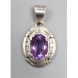 A continental sterling and amethyst set oval pendant, signed Carl Quintana,24mm.