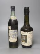 A bottle of J and F Martel Cognac and a bottle of 1991 cider brandy