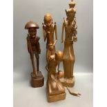 A group of three Balaris carved wood figures of mendicants and another similar figure, largest 52.