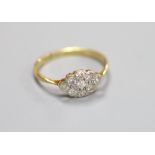 A 1920’s 18ct and plat, nine stone diamond set lozenge shaped cluster ring,size M, gross weight 2.3