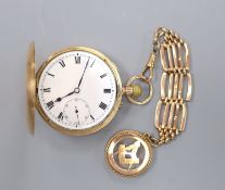A 20th century 9ct gold hunter keyless pocket watch, on a 9ct gold chain with masonic charm,gross