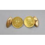 A pair of 1/8 pond gold mounted 15ct cufflinks, gross weight 11.6 grams.