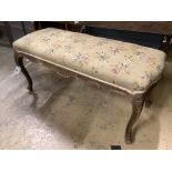 A late Victorian carved and stained beech dressing stool, width 97cm