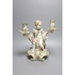 A large German porcelain 'Cupid' candelabrum, late 19th century, height 30cm