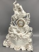 A 19th century German porcelain mantel clock modelled as a lion hunt, height 63cm