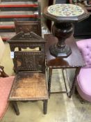 A Victorian Aesthetic movement carved oak hall seat, another carved oak chair, a tile top