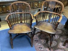A harlequin set of seven early 19th century yew and elm splat back elbow chairs