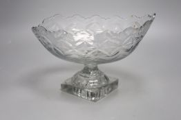 A George III Irish oval cut glass fruit bowl, lemon squeezer base, 27cm long (a.f)