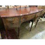 A late 19th century Sheraton style mahogany bowfront sideboard, fitted three drawers, length 140cm,