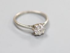 A white metal (stamped plat) and solitaire diamond ring,size M, gross weight 2.6 grams, the stone