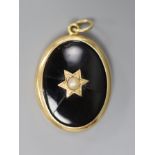 A Victorian Dublin oval yellow metal black enamel and split pearl set locket (Irish by family