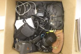 A box of cameras, binoculars and accesories