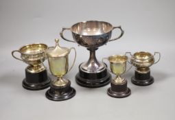A collection of five small silver presentation trophy cups,largest 10.8cm, 14oz.