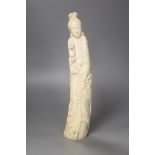 A Chinese ivory carving of a He Xiangu, early 20th century, height 34cm