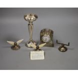 A George V silver cased bedside timepiece, a silver and ivory perpetual calendar and a pair of