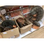 A large mixed collection of antique copper wares to include saucepans, kettles, etc.