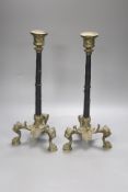 A pair of ormolu candlesticks, with lion paw feet, height 32cm