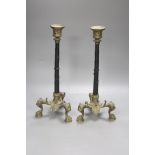 A pair of ormolu candlesticks, with lion paw feet, height 32cm