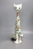 A tall Italian ceramic floral decorated cat, 57cm high