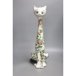 A tall Italian ceramic floral decorated cat, 57cm high