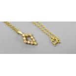 A modern 18ct gold and ten stone diamond chip set pendant, 16mm, on an 18ct chain, 37cm,gross 4.3