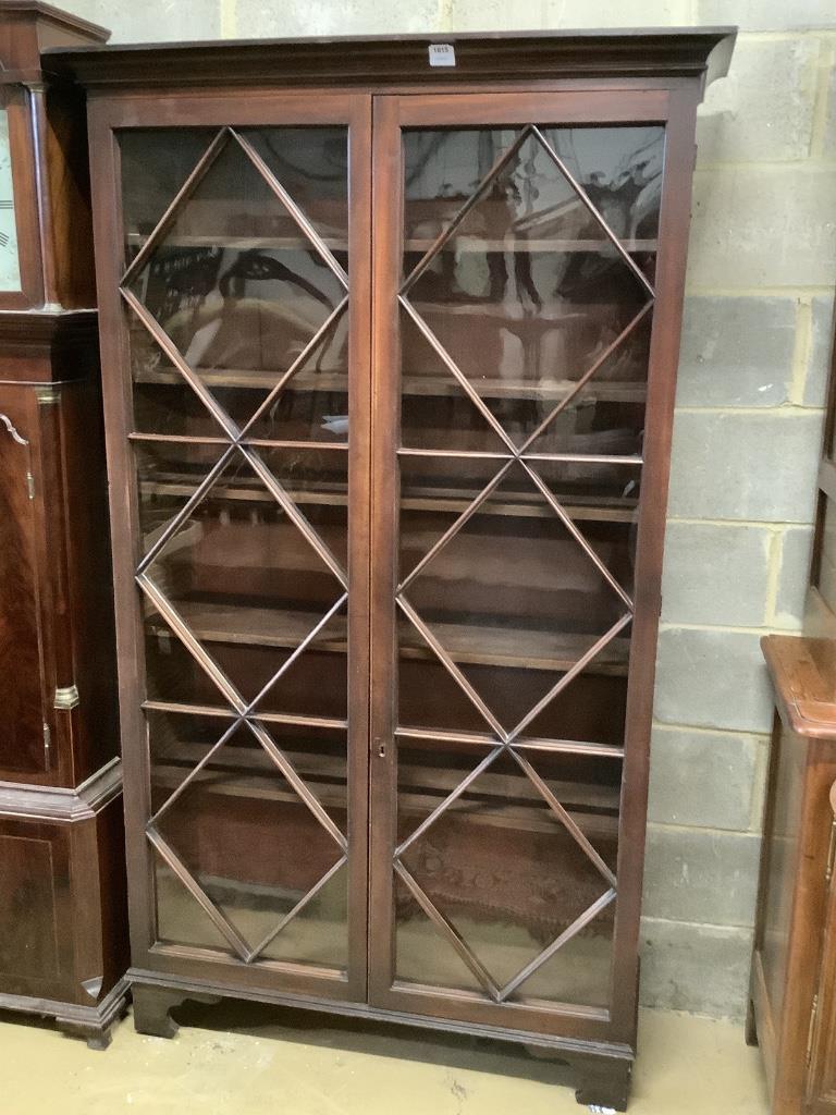 A George III mahogany bookcase with two astragal glazed doors, on later feet, width 116cm