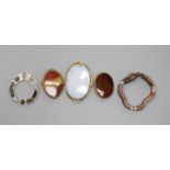 Four assorted base metal and chalcedony set brooches and a white metal and hardstone set serpent