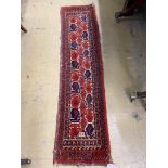 A North West Persian cream ground small rug, 39 x 159cm