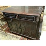 An early 18th century and later oak cupboard, with two frieze drawers, width 115cm