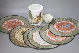 A Chinese porcelain brush pot, various embroidered silk mats etc.