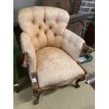A Victorian walnut button back armchair, width 77cm