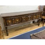 A Charles II oak dresser, fitted three drawers, with geometric mounted fronts, width 182cm, depth