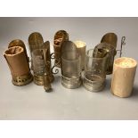 A collection of candle carriers