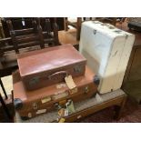 Four assorted vintage suitcases