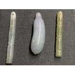 A Chinese jadeite gourd pendant, largest 43mm and two hardstone faux bamboo pendants.