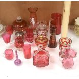 A collection of cranberry and ruby glassware including a 'Mary Gregory' vase