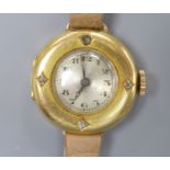 A lady's early to mid 20th century 18k yellow metal and diamond set manual wind wrist watch, on a
