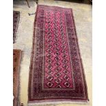 A Tekke Bokhara red ground rug, 254 x 109cm