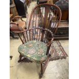 An Ercol comb back stained beech rocking chair, width 60cm, depth 50cm, height 106cm