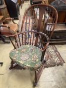 An Ercol comb back stained beech rocking chair, width 60cm, depth 50cm, height 106cm