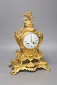 A late 19th-century French rococo revival gilt mantel clock, 40cm high