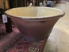 A Victorian glazed earthenware cream bowl, 52cm diameter