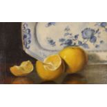 English School c.1900, oil on canvas, Still life of oranges and a delft plate, 17 x 29cm