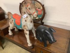 A painted carved wood pig, length 42cm, together with tin plate horse