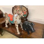 A painted carved wood pig, length 42cm, together with tin plate horse