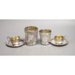 A pair of French white metal cups and saucers and two similar tumblers,8oz.